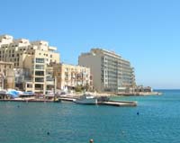 Cavalieri Hotel on the right, Spinola bay, St. Julian's Malta