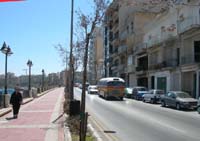 Photograph of a local bus on the waterfront main road, Tower road St. Julian's Malta