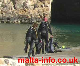 Scuba Divers about to enter the water